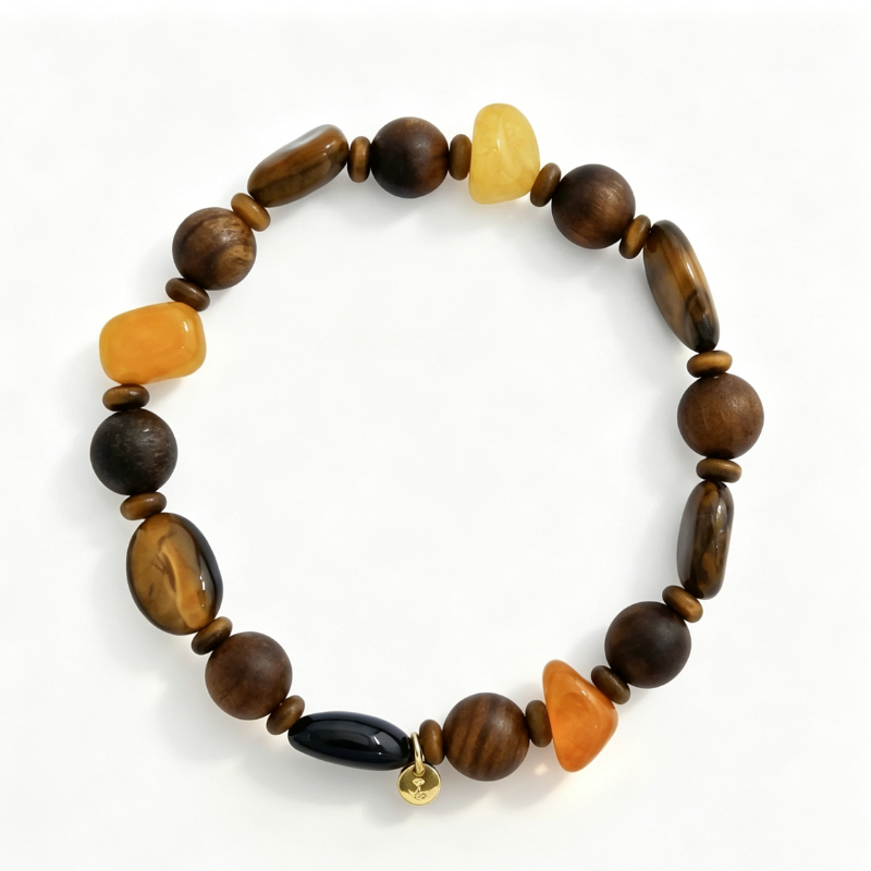 Blends earthy wooden beads with chatoyant tiger's eye and vibrant agate for an organic, grounded look; features shifting golden-brown sheens that bring subtle movement to deep wood tones; and is finished with a delicate minimalist charm for a balanced blend of rustic texture and daily comfort.