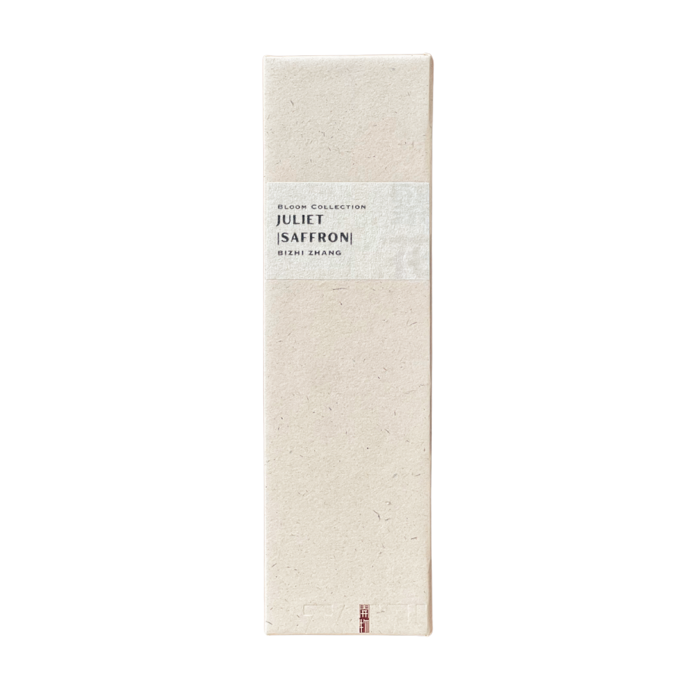 Sustainable Juliet Saffron Incense box in champagne hue - recycled paper wrap with debossed Kaiwu emblem & artisan Bizhi name on handmade yellow textured label, embodying mindful luxury.